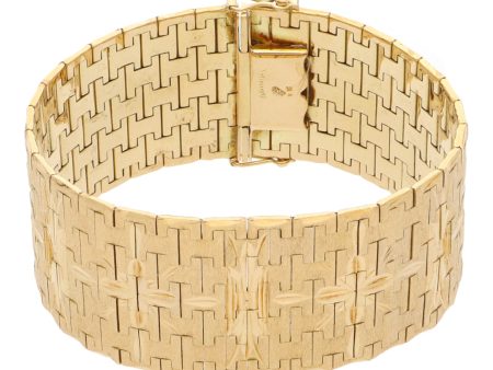 Brazalete eslabón articulado labrado en oro amarillo 18 kilates. Online Sale