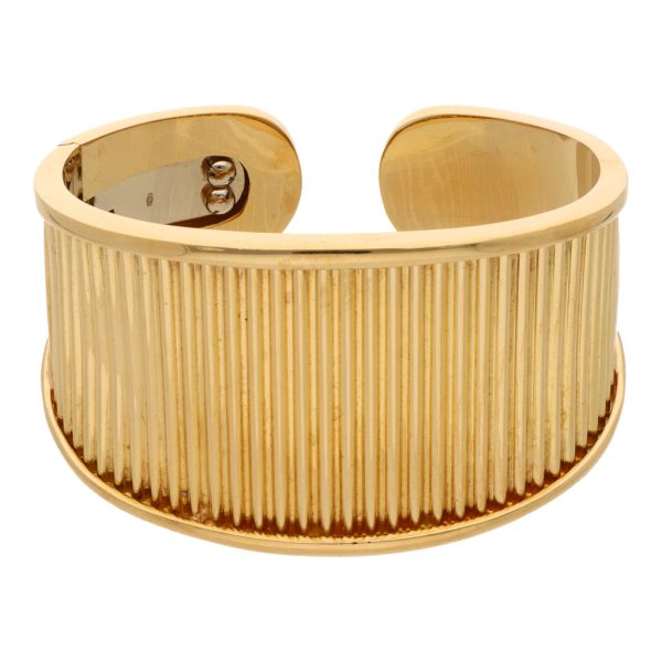 Brazalete abierto articulado en oro amarillo 18 kilates. Hot on Sale